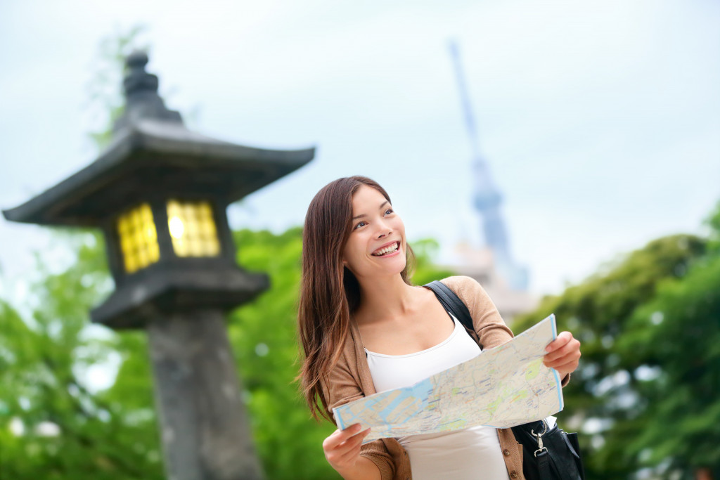 female traveller holding a map