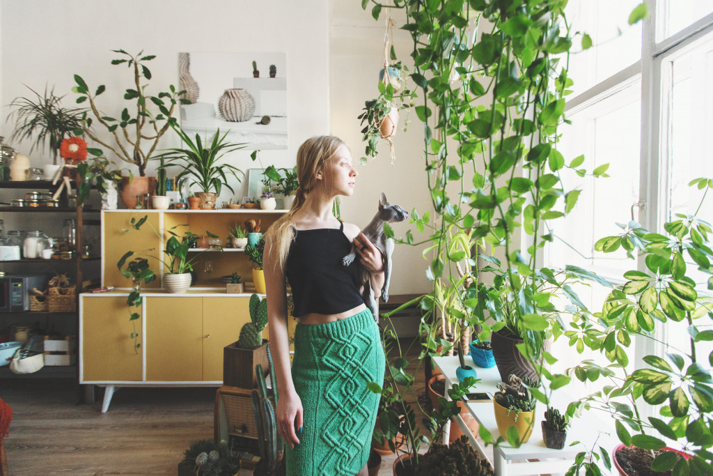 Woman with plants at home