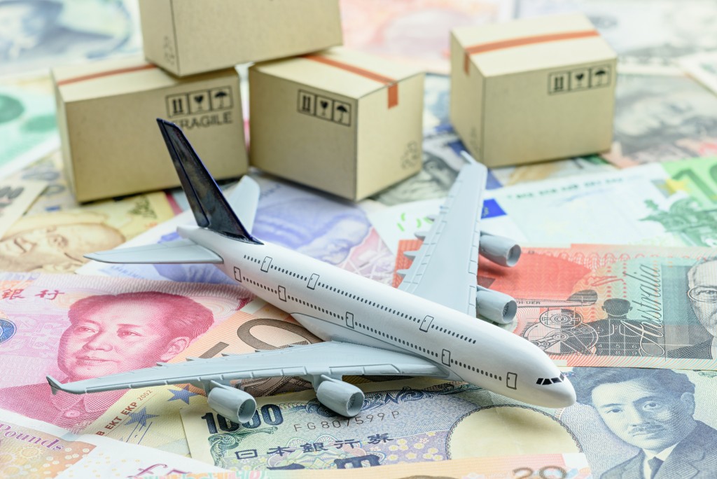 airplane miniature with boxes and bills