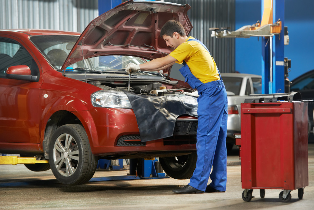 car mechanic repairing a car