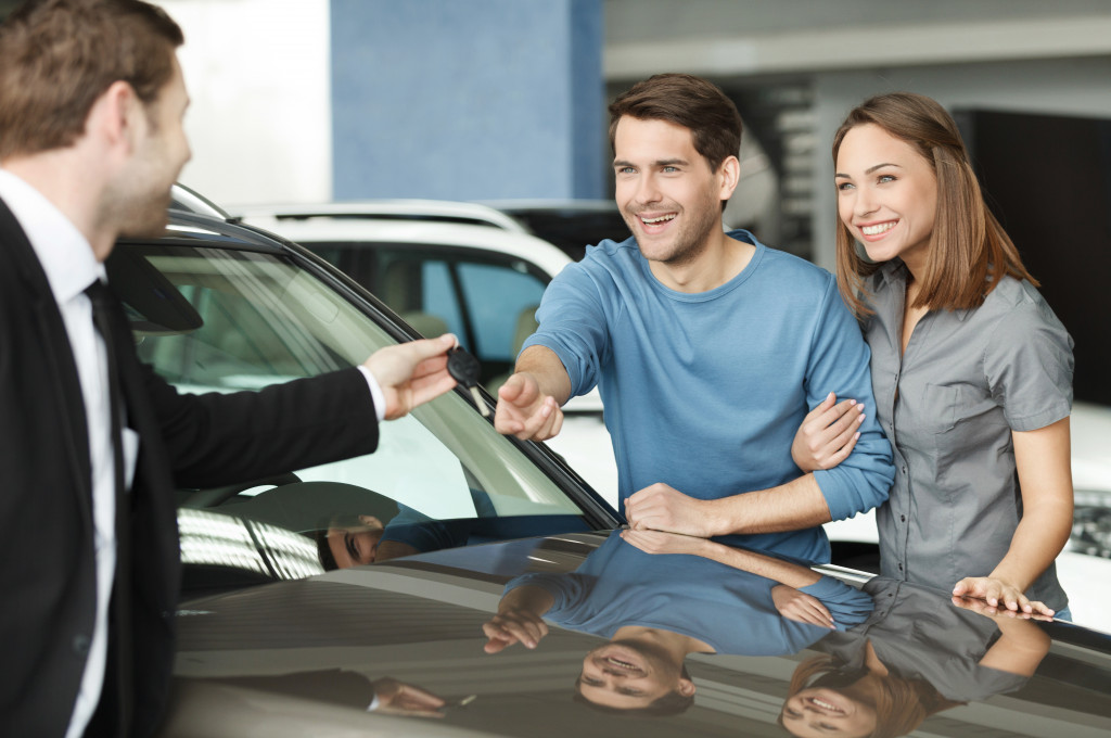 a couple buying a car