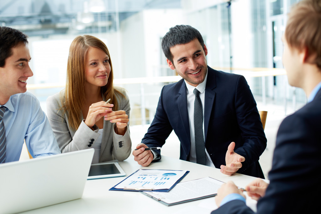 employees having a conversation on a table