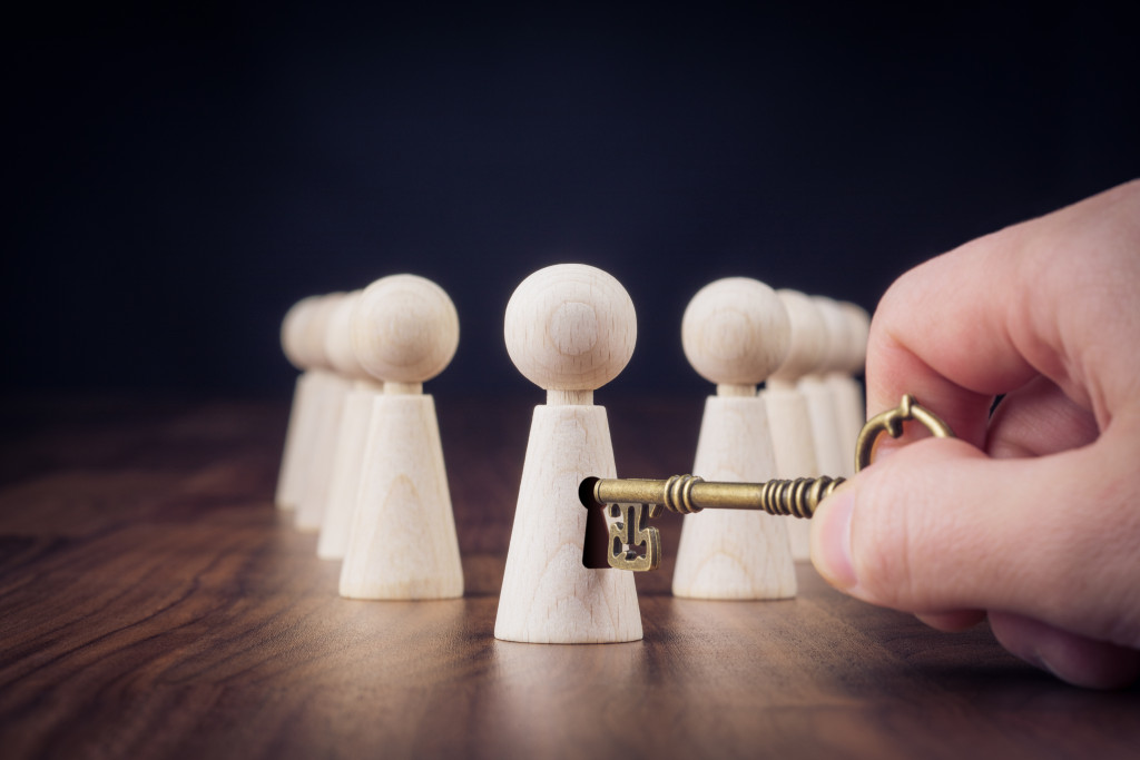 wooden figurines and key