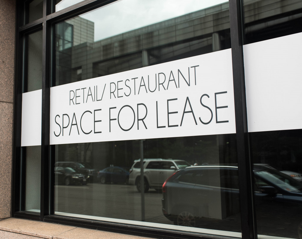 Signage saying retail/restaurant space for lease