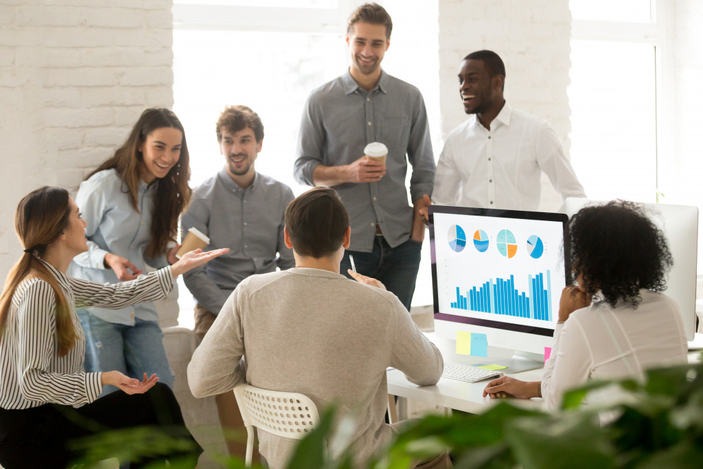 Employees interacting with each other in a modern office space