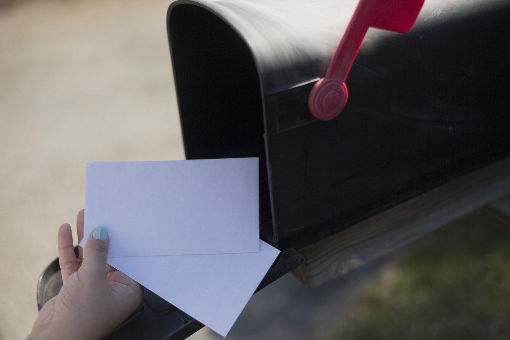 person putting mail