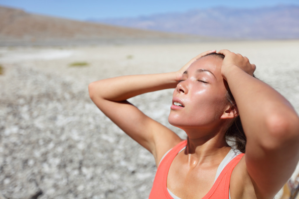 Young woman dehydrated while at a desert.