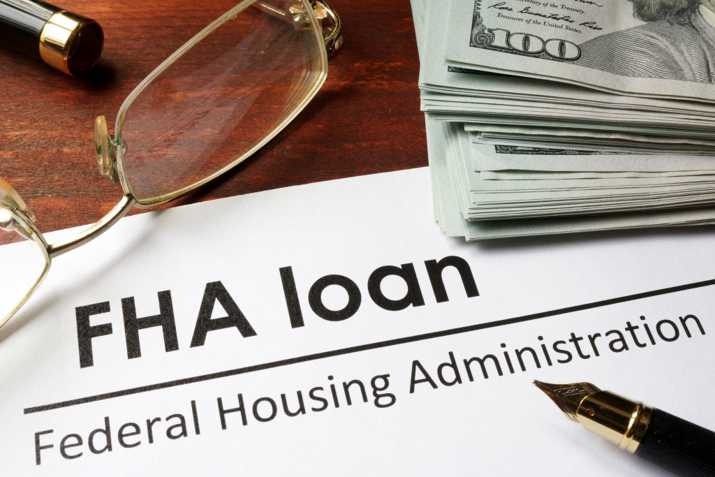 FHA loan paper with dollar bills