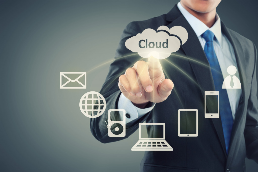 businessman pointing at cloud computing on virtual background