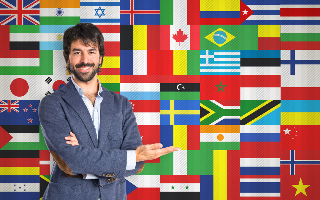 businessman presenting foreign flags