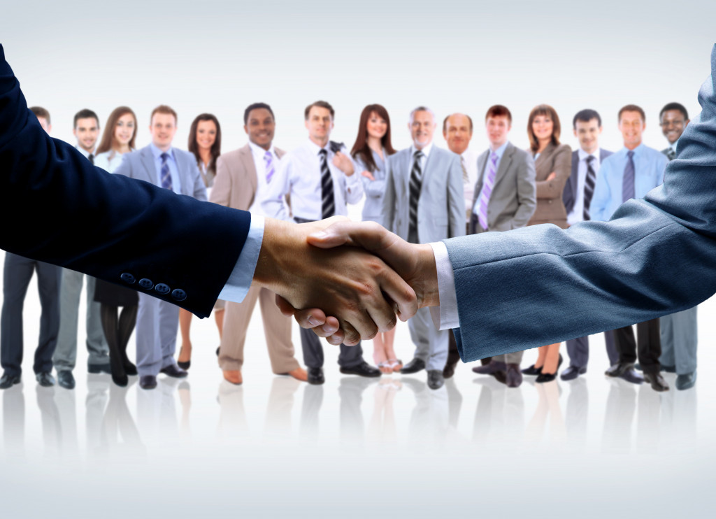 entpreneurs handshake on business concept background