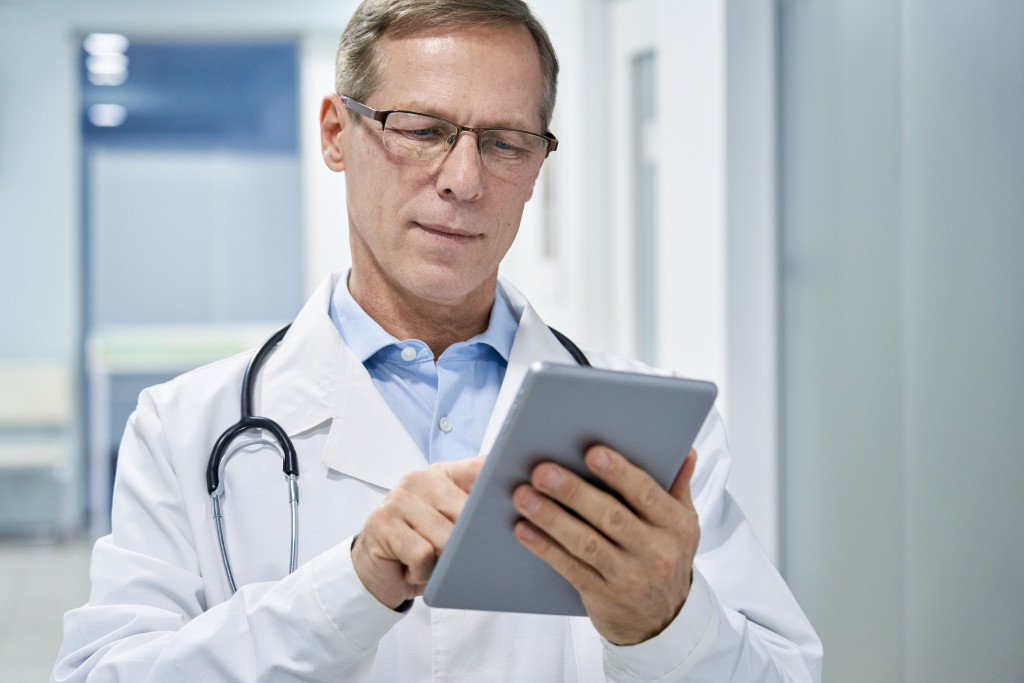 doctor holding digital tablet