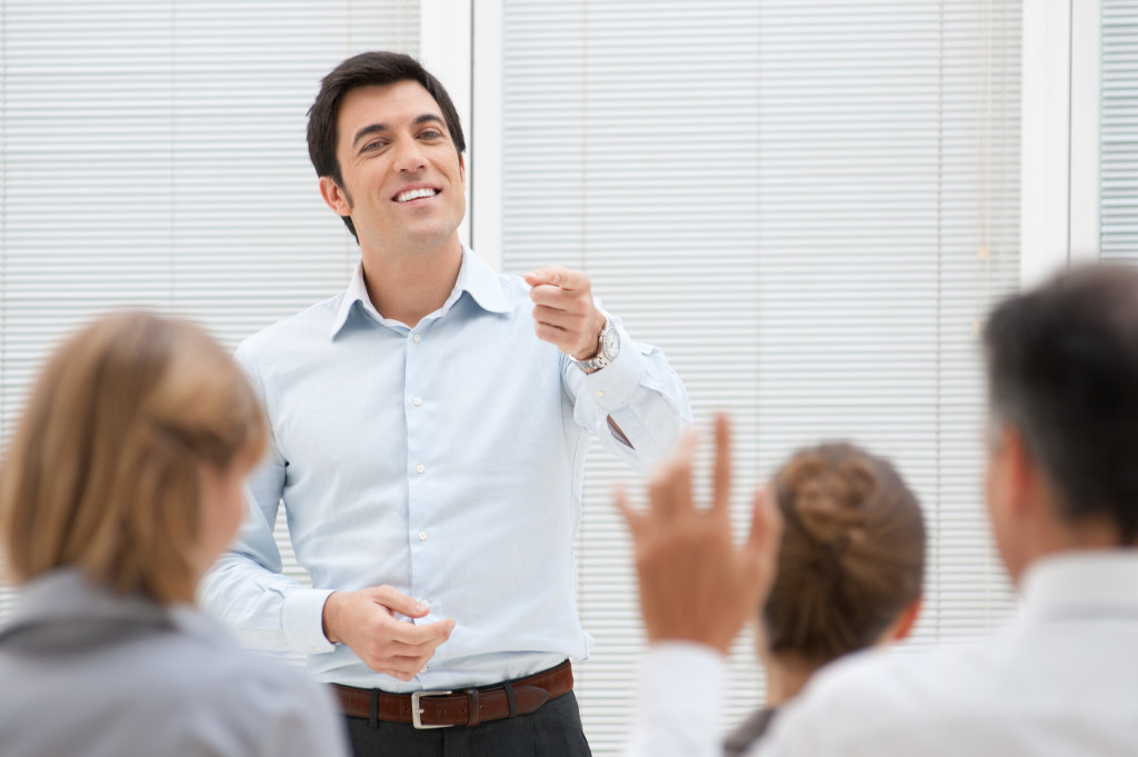 business owner meeting with his employees in the conference room