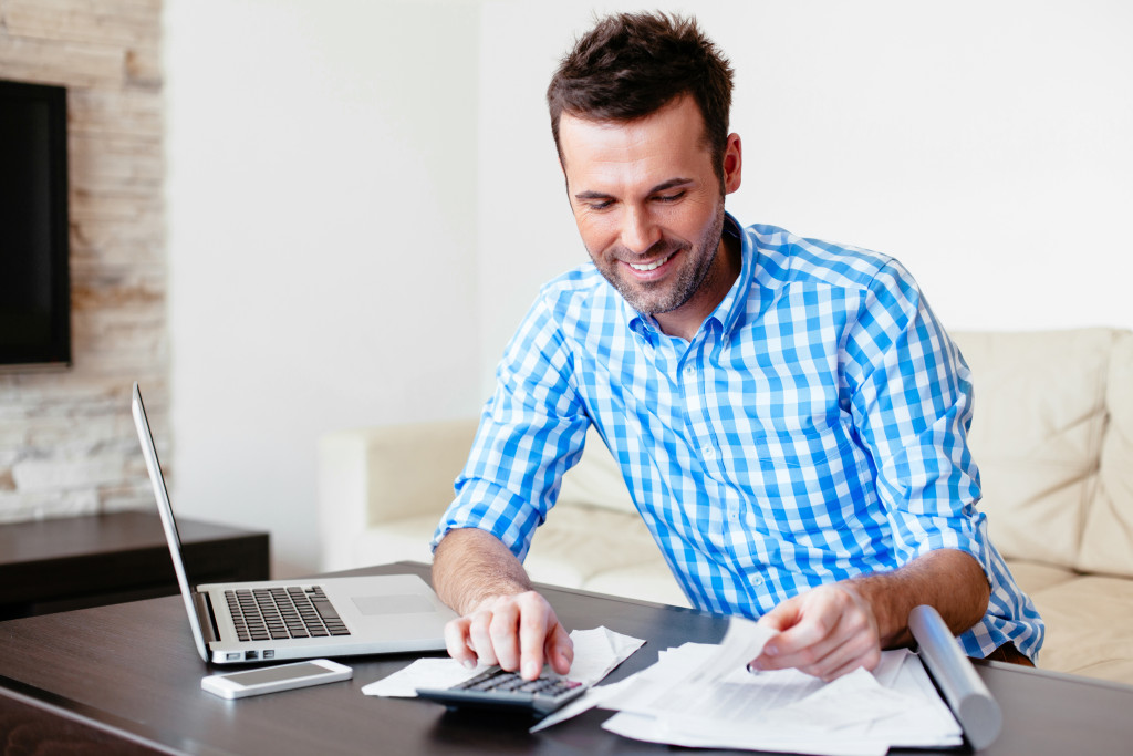 businessman calculating his budget and expenses