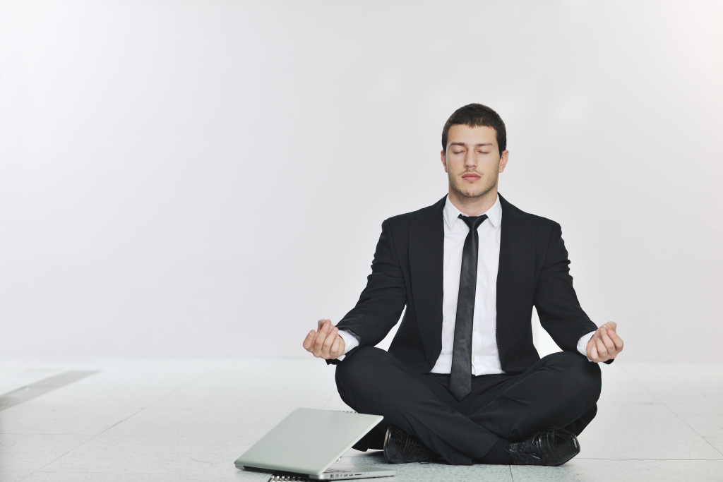 business man meditating