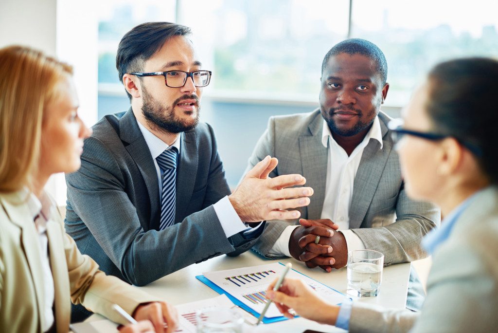 team leader educating employees at a meeting