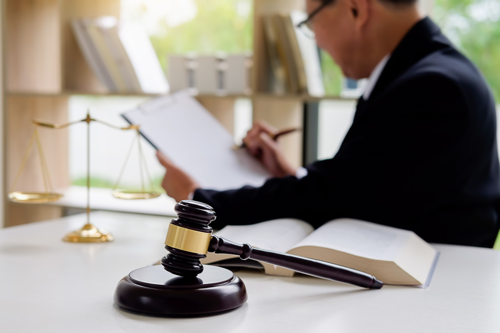 A lawyer in his office with a gavel on his table