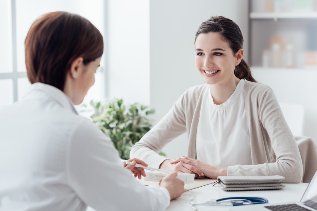 A woman consulting a doctor in a clinic