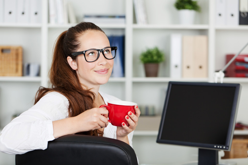 A businesswoman taking a coffee break at work