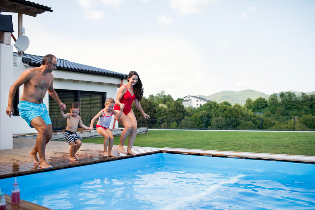 children by swimming pool outdoors